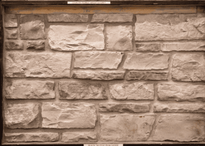 A picture of a stone wall in sepia.
