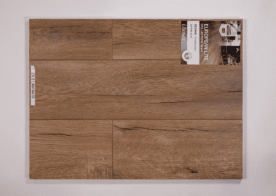 A picture of a wooden plank on a wall, showcasing the craftsmanship of Riding Homes, a renowned custom home builder in Southern Utah Valley.