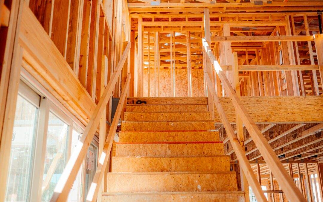 A custom home builder is constructing a house in Southern Utah Valley, which features a staircase that is currently under construction.